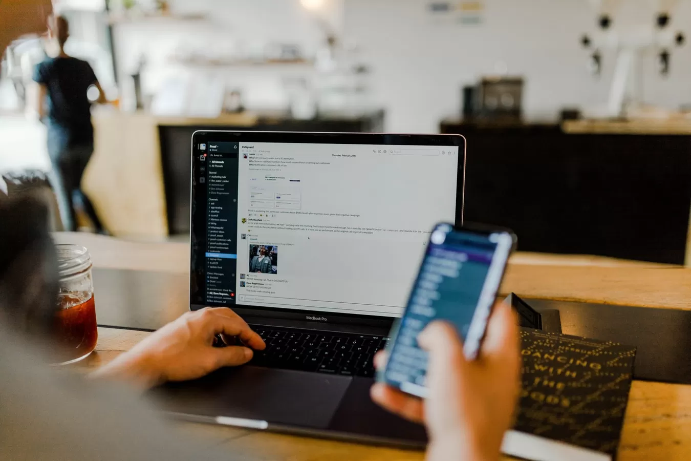 Laptop and smartphone desk used by person
